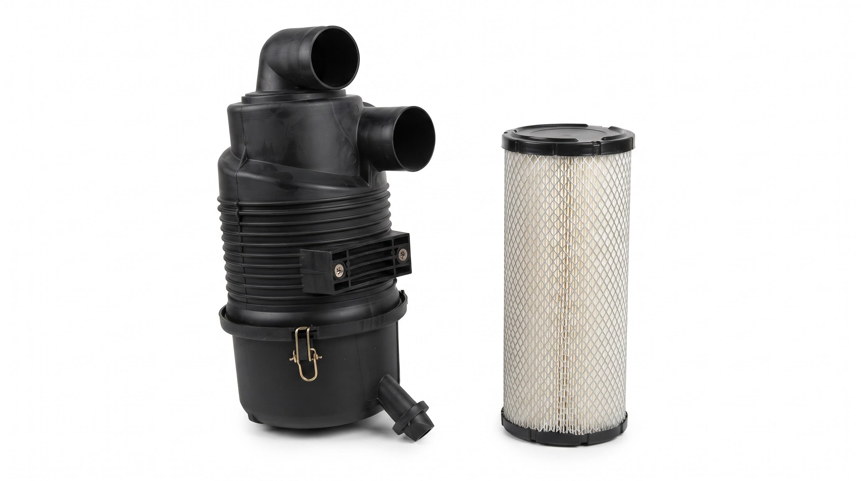 Air intake filter housing with its paper filter cartridge — a routine service item for engine air intakes.