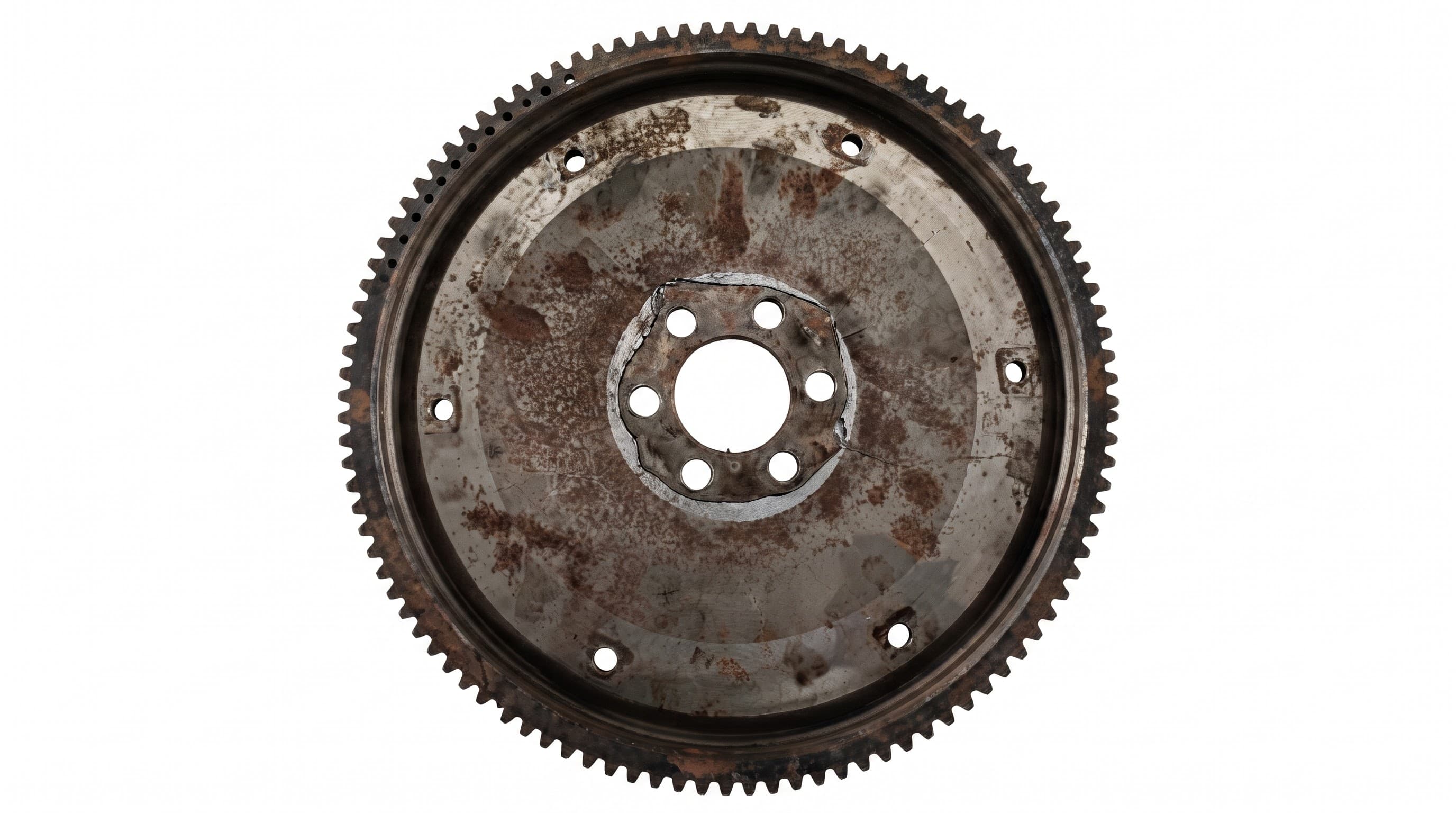 Flywheel with a starter ring gear around the rim and a six-bolt crank mounting.