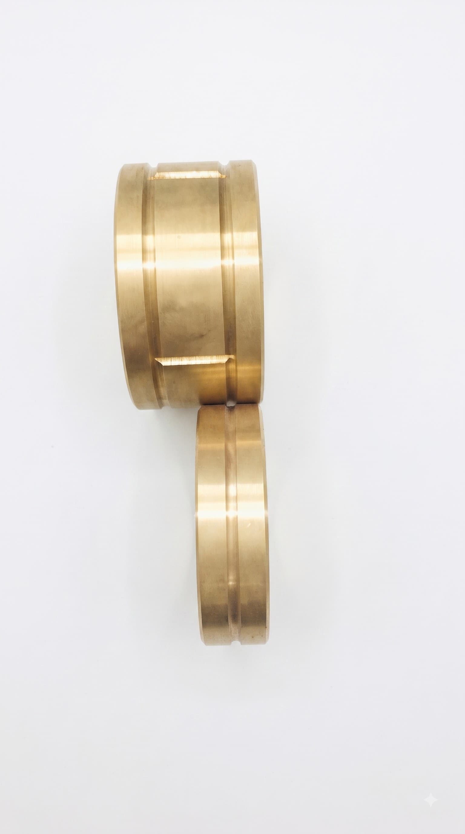 Machined Bronze Bushes — precision-turned bronze bushings with keyway slots, fitted as a low-friction wear bearing wherever a shaft needs to run true.