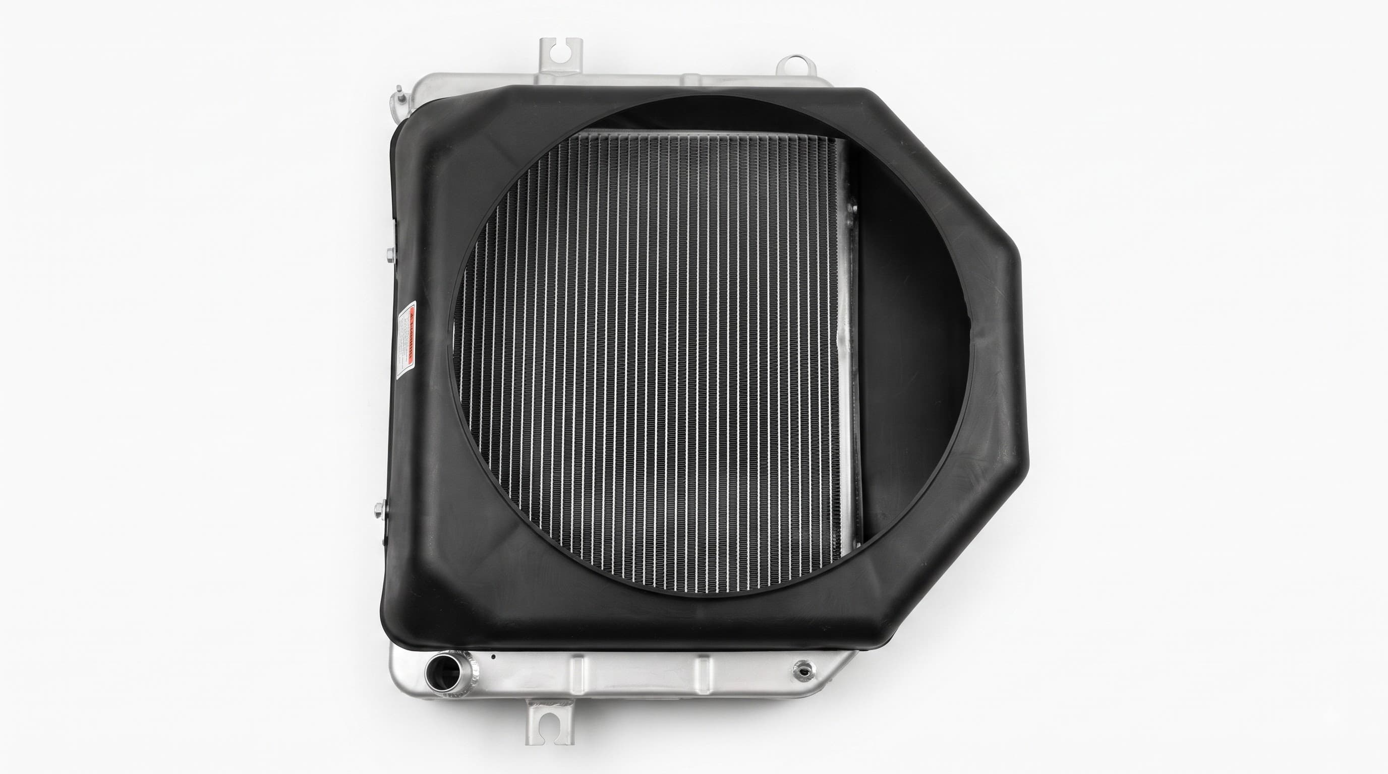 A third radiator fitment with an angled shroud profile, showing the range of shapes we match to different machines.
