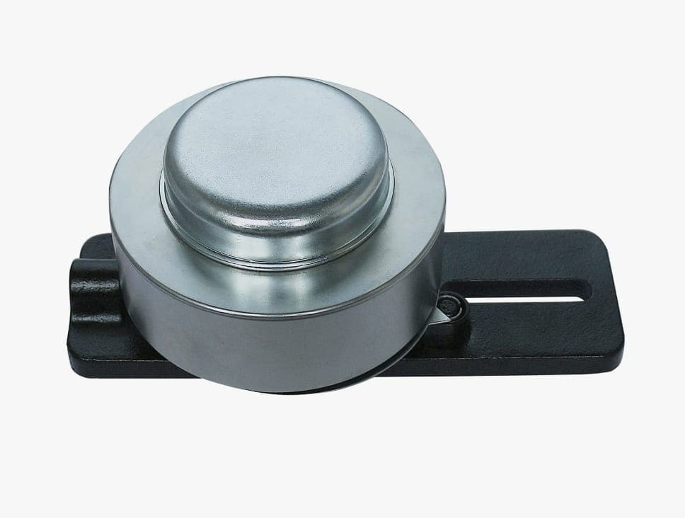 Skid Steer Idler Pulley — an idler pulley on its mounting bracket, used to guide and tension the drive belt or track.
