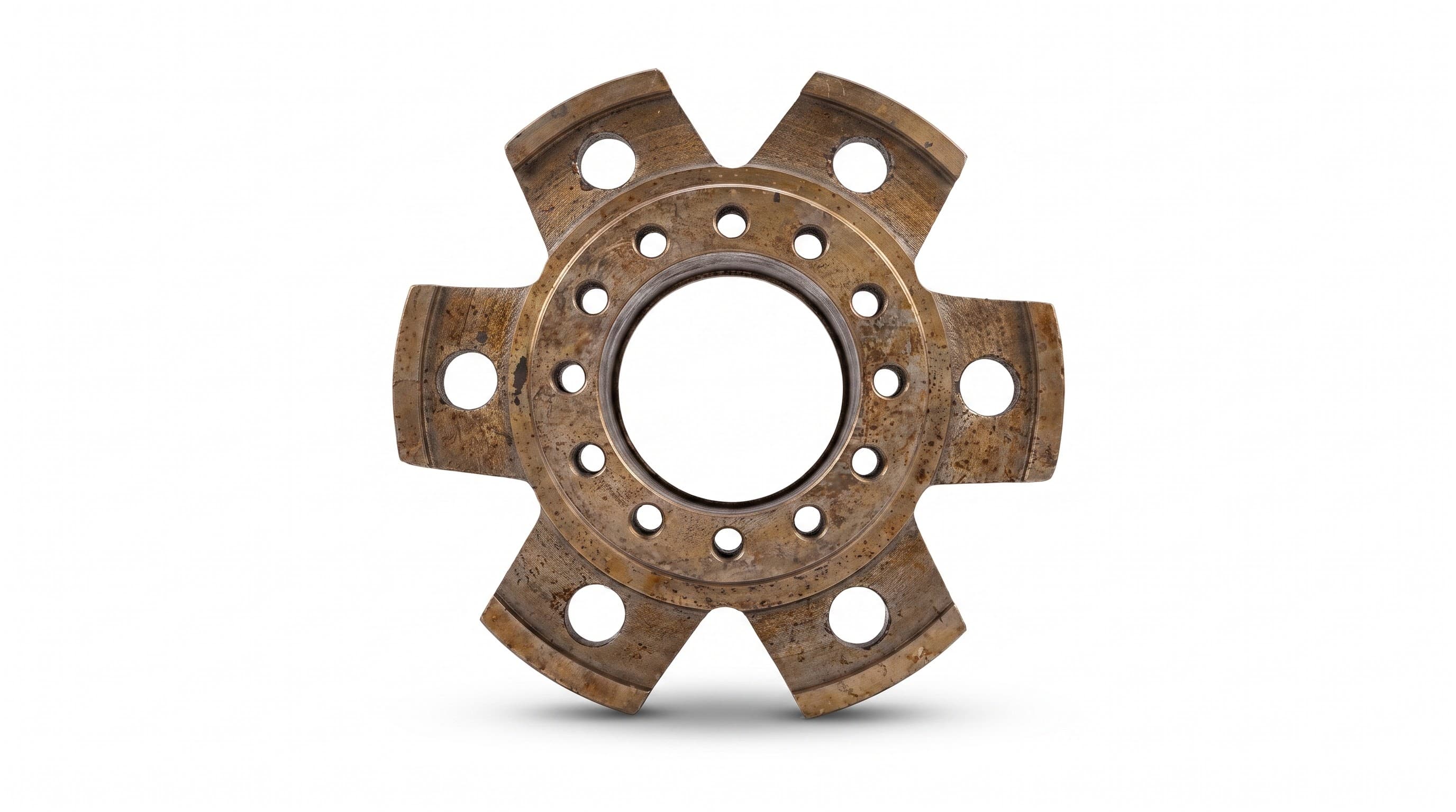 A worn six-bolt hub or brake-mounting plate, shown as removed from service — illustrating the wear parts we replace.